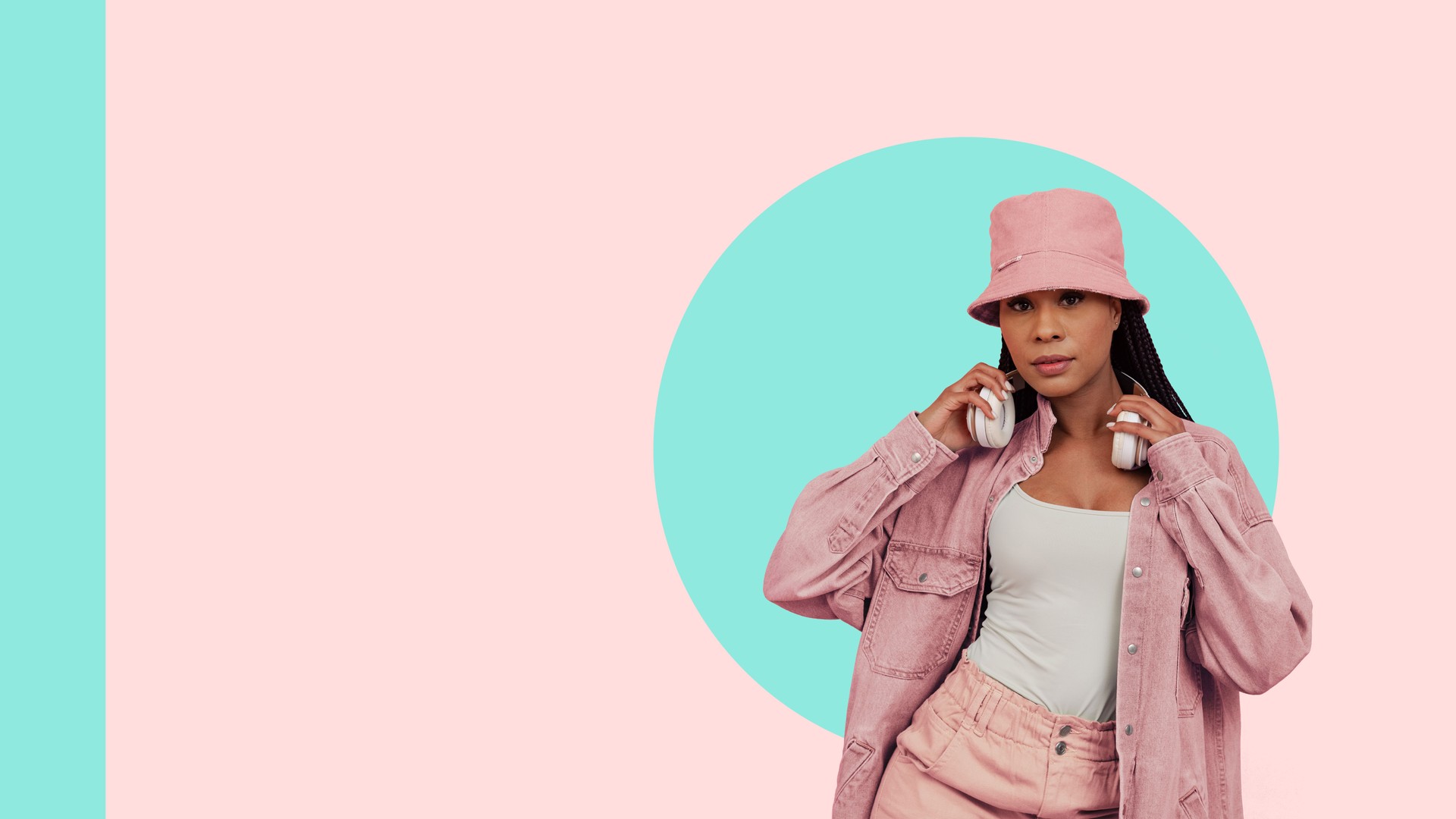 Young woman dressed in pink casual outfit and bucket hat, holding headphones, set against pastel mint and peach background.